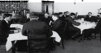 Members of the Poison Squad dine at the 'hygienic table' located in the former Bureau of Chemistry building in Washington, D.C. Experiments conducted there a century ago by Harvey W. Wiley. MD. were designed to test the safety of food preservatives.