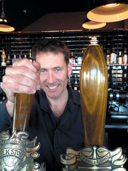 Zak Cassels pouring a beer at Cassels & Son's new bar in Madras Street, Christchurch