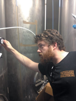 Chris Darby checking equipment at Cassels & Sons brew bar in Woolston, Christchurch